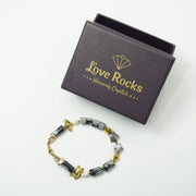 Snowflake Obsidian Bracelet: Lotus and Conch Charms